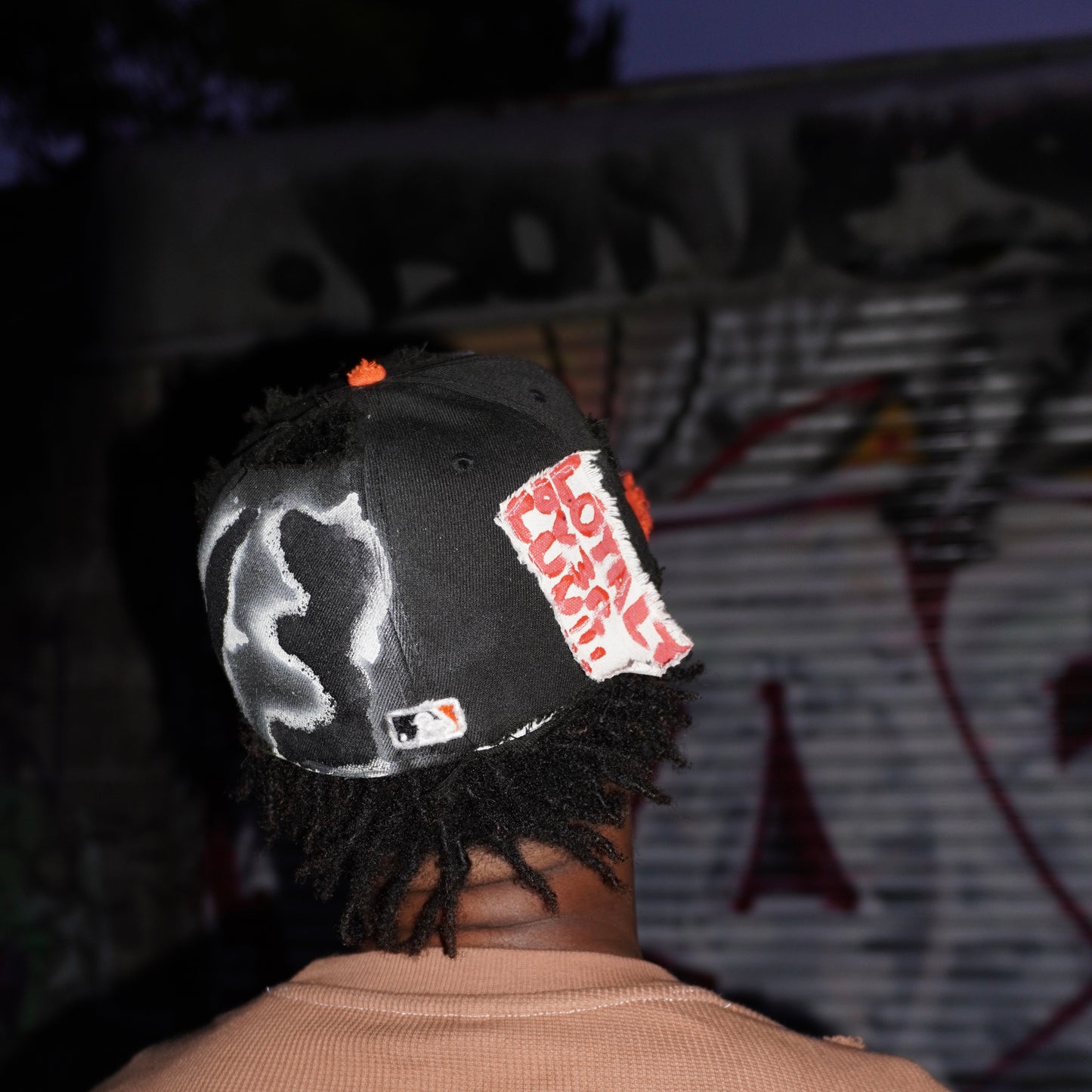 ORANGE AND BLACK “LOUVE” FITTED CAP